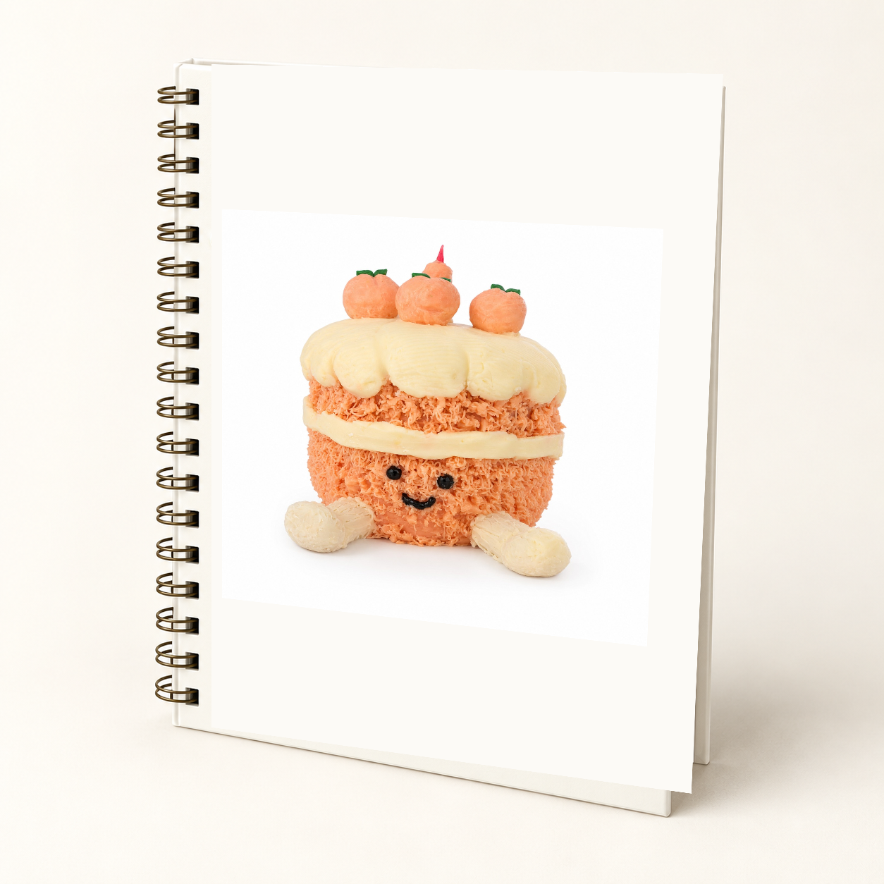 Peach Cake hard cover Wire-O journal mockup featuring the approved smiling Peach Cake and garden artwork on an ivory cover.